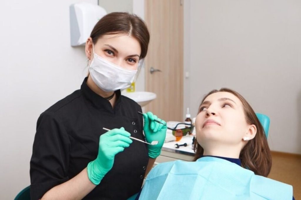 dentist performing dental crown evaluation during restorative dental consultation