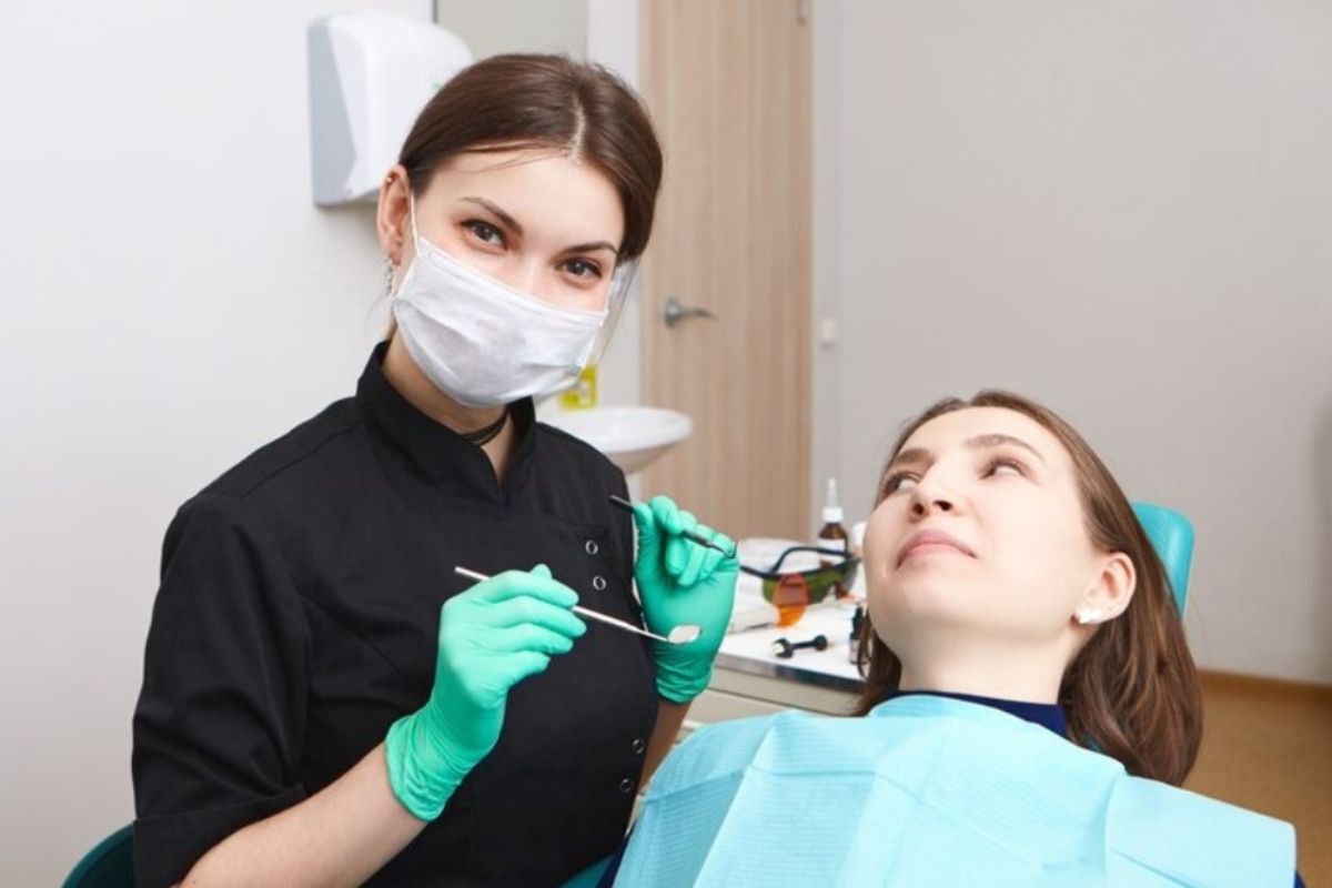 dentist performing dental crown evaluation during restorative dental consultation